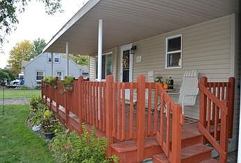 The front of the home features a large covered front porch.  Perfect for providing cover for any unexpected weather.