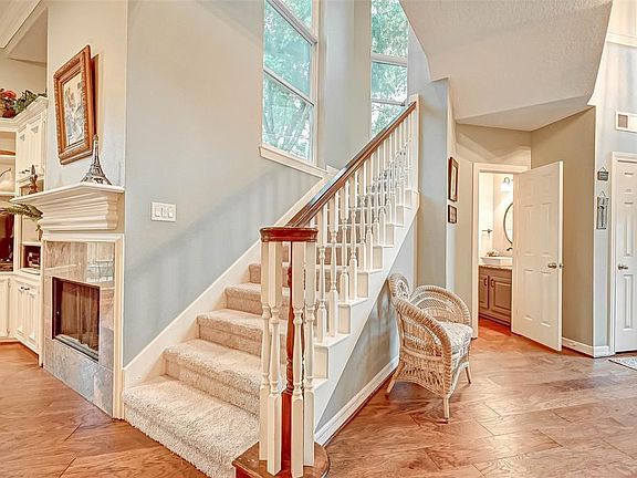 Another angle showing the foyer with guest bathroom.