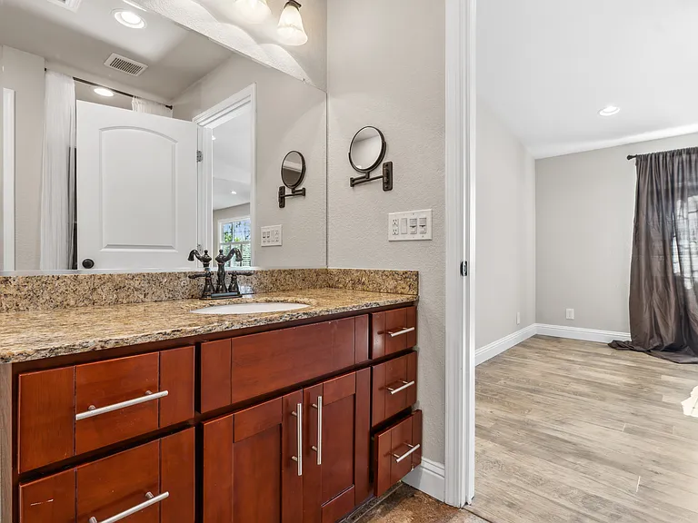 1/2 bathroom and living room in background