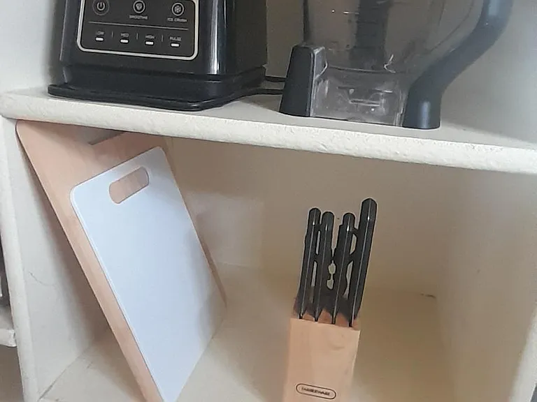 Pantry. Blender, knives and cutting boards.
