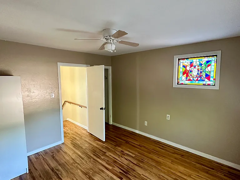 Bedroom, closet behind door.
