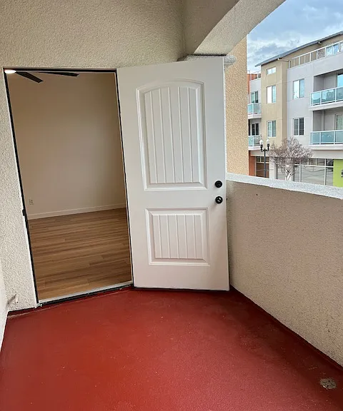 Private balcony on Lewis St Door is to the living area nearest the windows and to the left is the picture window from the bedroom