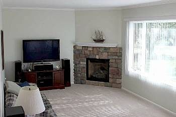 Pleasant family room in back with gas burning fireplace