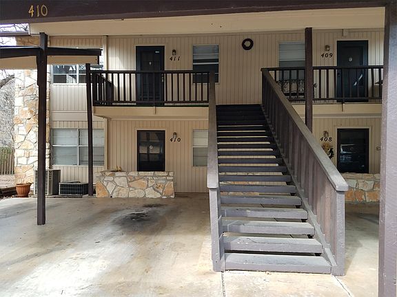 1 reserved covered car port space with stairs leading to the unit