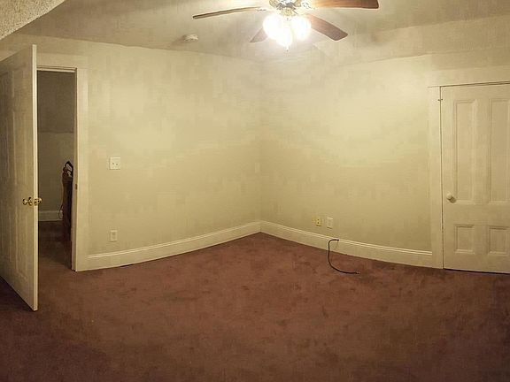 3rd bedroom with deck overlooking the back yard
