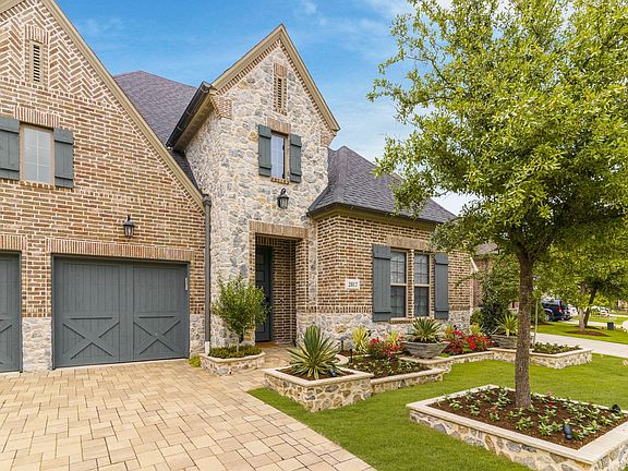 Step into Luxury & Perfection in The Tribute! From the driveway pavers to the landscape borders to the interior upgrades, including finished attic space...this home is truly one-of-a-kind!