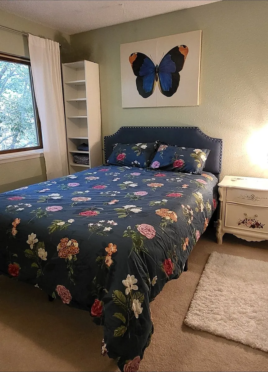 Guest room has queen bed, work space with desk and office chair, dresser, T.V. and closet. - Lydia Dr