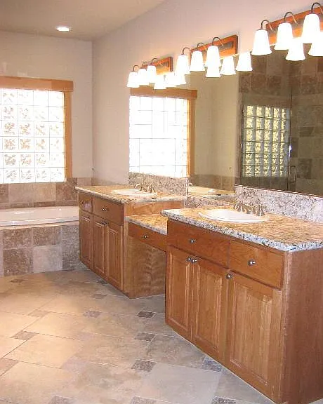 Ist master bath with two sinks, with heated floors. Jacuzzi tube and double head shower, walk in closet to the Right