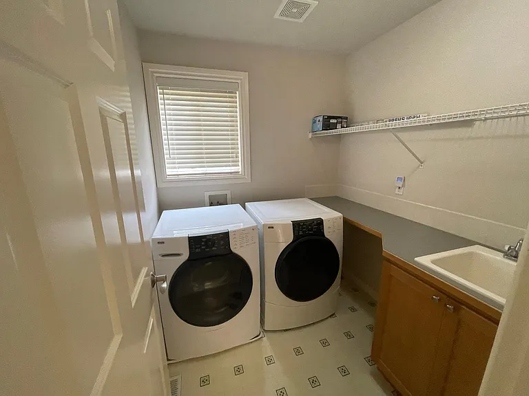 Laundry Room with Sink. Washer has been newly replaced since photograph was taken.