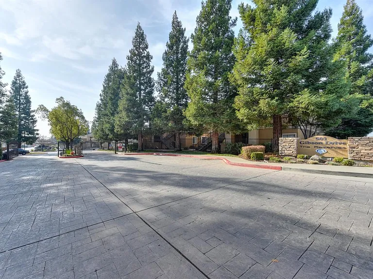 501 Gibson Drive, Gate and view of the front of the condo complex.