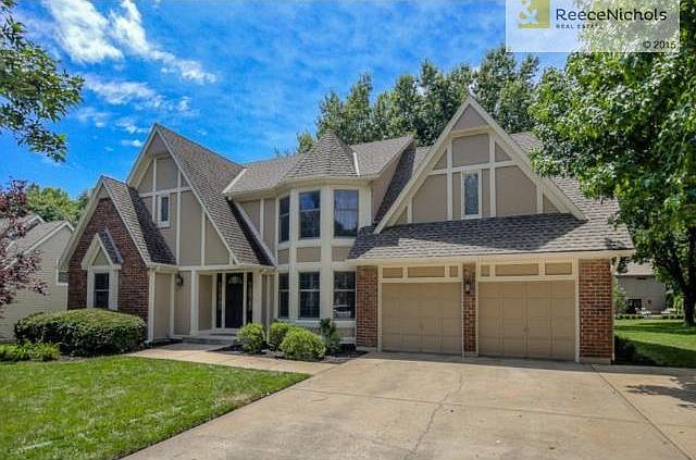 Beautiful home with lovely landscaping and fresh paint.