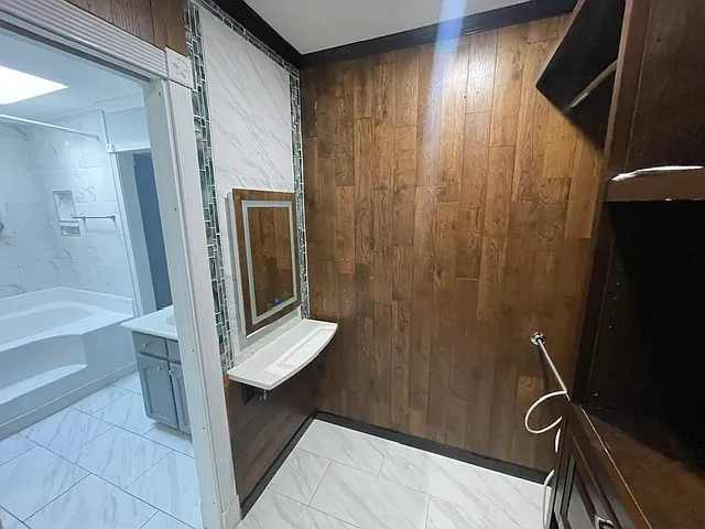 Quartz makeup table/ lighted mirror on tile wall