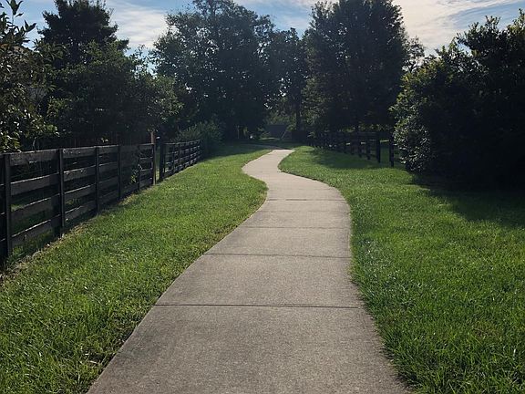 Walking trail just steps from your patio.