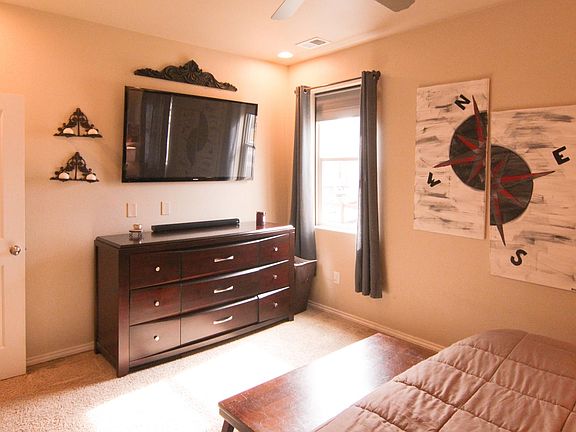 65" Smart TV stays for the renter. Two big windows provide plenty of natural light, with blackout shade for night.