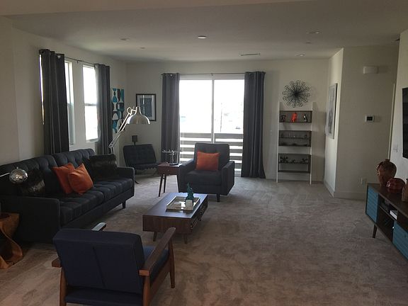 Large open living room area with balcony.