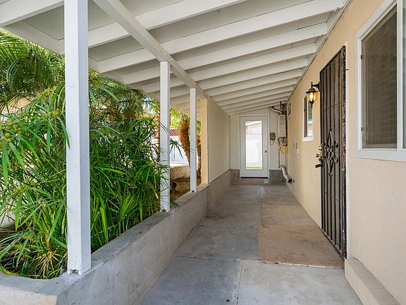 Rear Covered Patio and Entrance to Backyard.