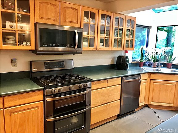Enjoy new chrome-shadow appliances throughout the kitchen. You will be spoiled with deep drawers, ample counter and cabinet space. 