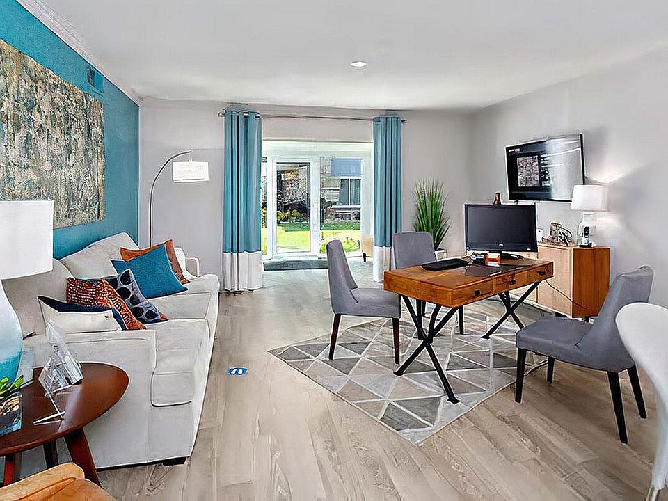 Experience the blend of style and comfort in this modern living room oasis.