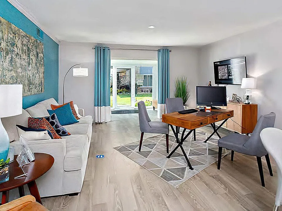 Experience the blend of style and comfort in this modern living room oasis.