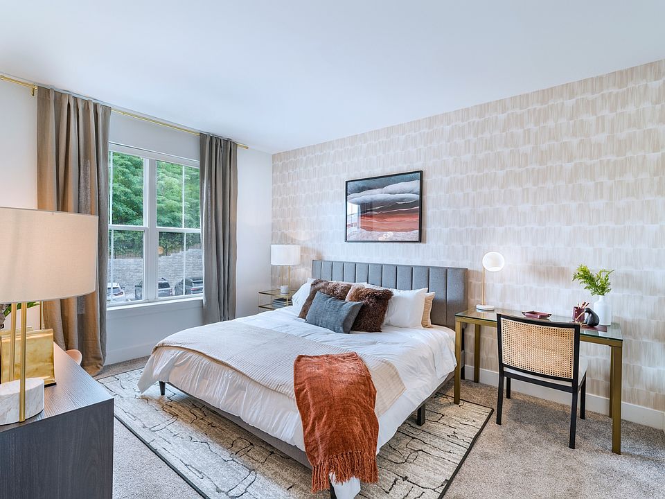 Unwind in comfort and style with Modera Montville's spacious bedrooms featuring large custom closets designed to accommodate your bed.