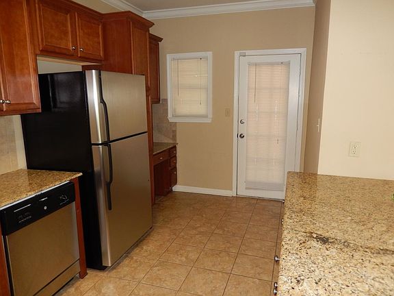 Desk area in kitchen; door leads to back screened porch
