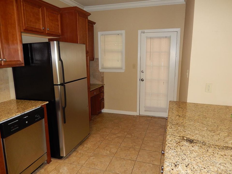 Desk area in kitchen; door leads to back screened porch