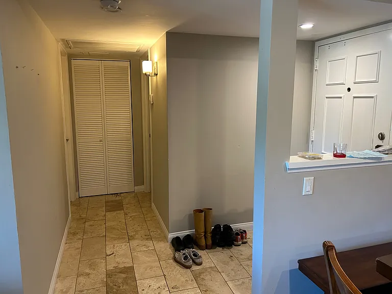 Washer/dryer in this hallway, opposite of your room.