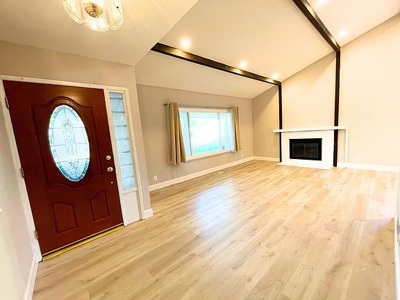 Living Room, with vaulted ceilings and recessed lights, photo taken Oct 2023 when last vacant