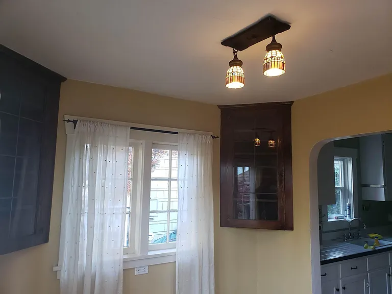 Charming built-ins and stained-glass light fixtures.