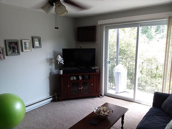Living Room with Ceiling Fan and Air Conditioning