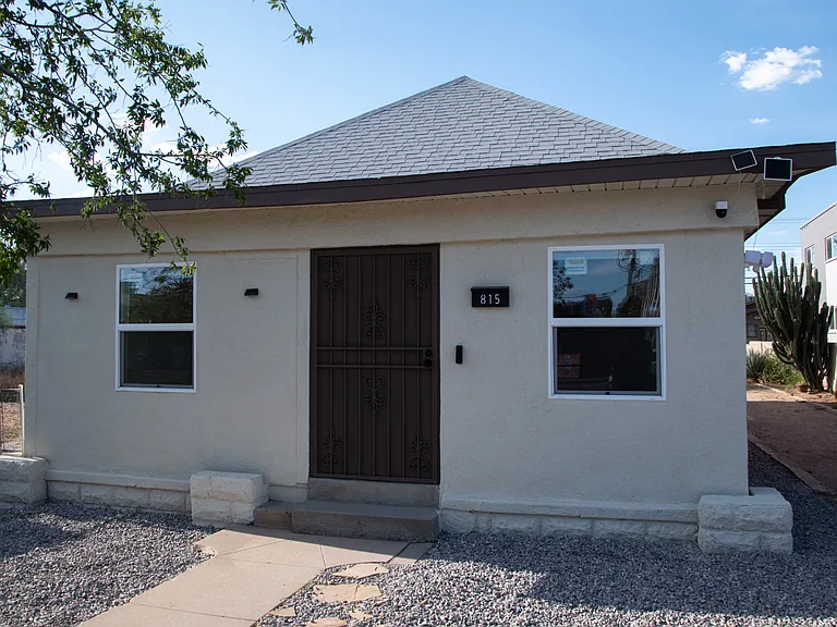 Security system included with two cameras and motion sensor spot lights at night.