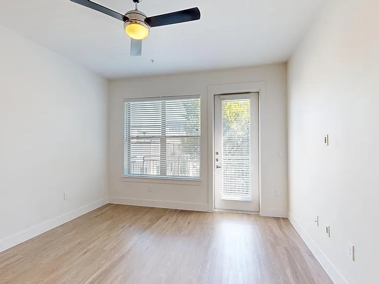 Apartment living room with wood-style flooring.