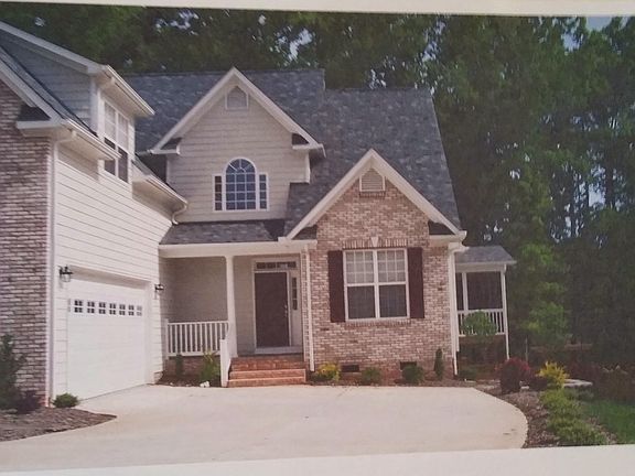 view of garage ,screen porch