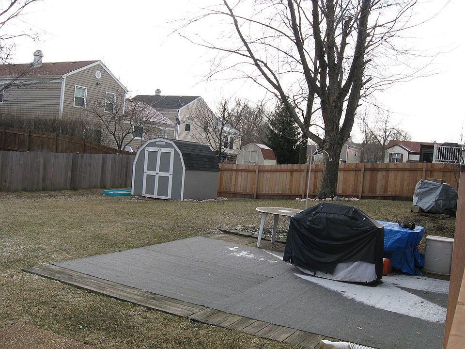 Fenced in large backyard with shed for more storage.