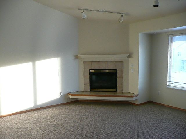 spacious living room/wood fireplace