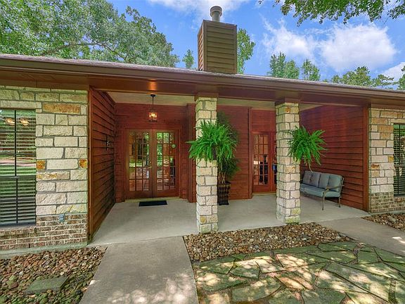 Inviting front porch welcomes you to double french doors.