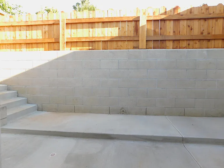 Enclosed back patio separating front and back house