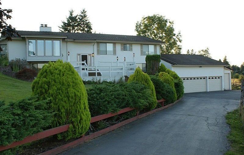 House from gated driveway entry.