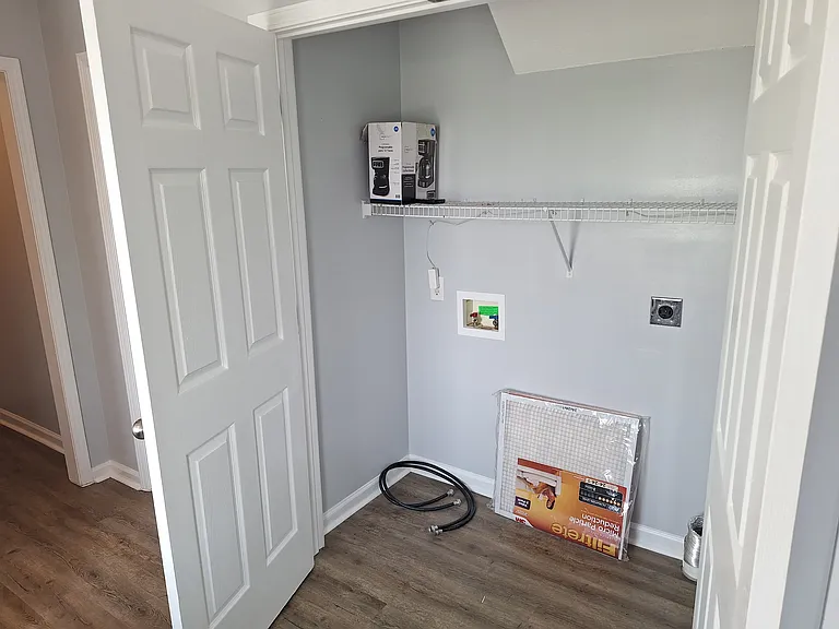 Washer dryer hook-up with storage space