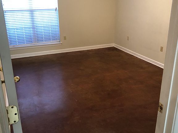 Master bedroom with large double window, bathroom & walk in closet.