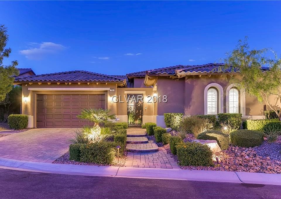 Elegant Front Entry with Pavers  enhancing both the  Driveway and Sidewalk, plus Landscape Lighting