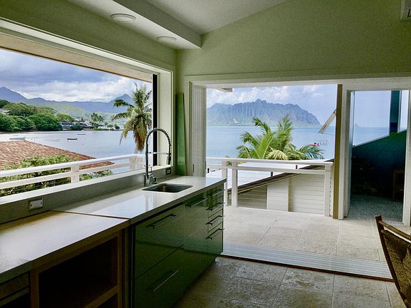 Inside is like outside. Kitchen windows are stackable for a wide open feel.