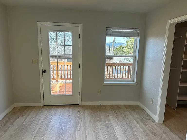 Primary Bedroom with walking closet and door to deck