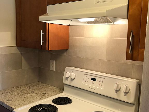 Electric range and vented exhaust hood.