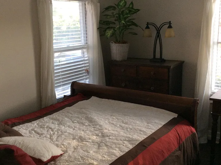 Fourth bedroom with two windows.