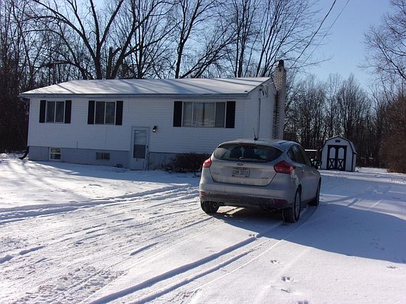 This side of the house also features the large driveway and 
