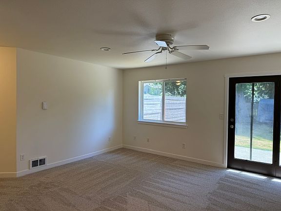 Living room with door to back yard