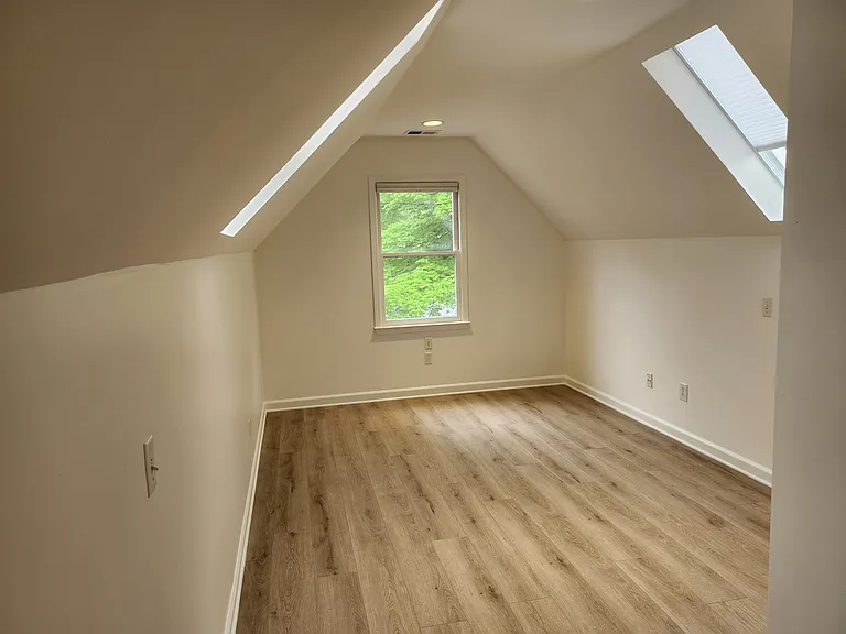 3rd bedroom upstairs with skylights