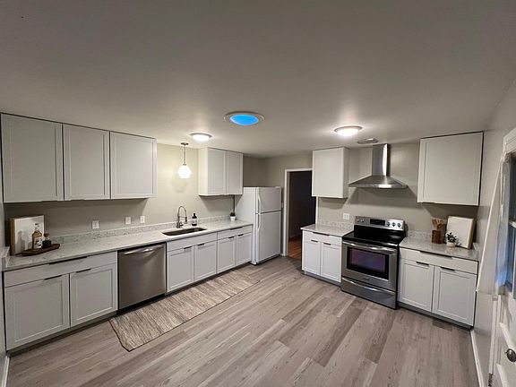 Fully updated kitchen with new cabinets, granite counters, and stainless appliances