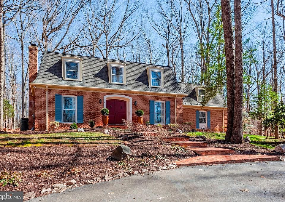 Beautiful all-brick colonial with Mansard roof.